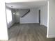Open living room with a staircase, new floors and a light and airy feel at 5260 42Nd S St, St Petersburg, FL 33711