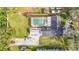 Aerial view showcasing the home, pool, and boat at 8613 Beth Ct, Odessa, FL 33556