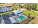 Aerial view showing home, pool, and detached workshop at 8613 Beth Ct, Odessa, FL 33556