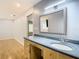 Bathroom with single vanity, mirror and access to bedroom at 8613 Beth Ct, Odessa, FL 33556