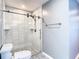 Modern bathroom featuring a large walk-in shower and updated fixtures at 8613 Beth Ct, Odessa, FL 33556