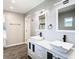 Updated bathroom with double vanity, modern fixtures, and a walk-in shower at 8613 Beth Ct, Odessa, FL 33556
