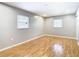 Spacious bedroom with light gray walls, wood flooring and double closets at 8613 Beth Ct, Odessa, FL 33556