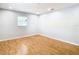 Spacious bedroom with light walls and wood-look flooring at 8613 Beth Ct, Odessa, FL 33556