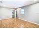 Spacious bedroom with light gray walls, wood flooring, and closets at 8613 Beth Ct, Odessa, FL 33556