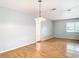 Bright dining room with hardwood floors and views to other rooms at 8613 Beth Ct, Odessa, FL 33556