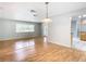 Bright dining room with hardwood floors and views to other rooms at 8613 Beth Ct, Odessa, FL 33556