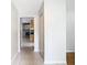 Hallway with tile floors and view of the kitchen at 8613 Beth Ct, Odessa, FL 33556