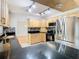 Modern kitchen features stainless steel appliances and granite countertops at 8613 Beth Ct, Odessa, FL 33556