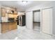 Bright kitchen with light wood cabinets and tile flooring at 8613 Beth Ct, Odessa, FL 33556
