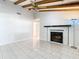 Spacious living room with exposed beams and fireplace at 8613 Beth Ct, Odessa, FL 33556
