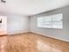 Spacious living room with light walls and wood flooring at 8613 Beth Ct, Odessa, FL 33556
