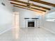 Living area with fireplace, high ceilings and wood beams at 8613 Beth Ct, Odessa, FL 33556