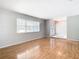 Living room with wood floors and a view of the entryway at 8613 Beth Ct, Odessa, FL 33556