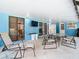 Covered patio with outdoor seating and a view of the pool at 8613 Beth Ct, Odessa, FL 33556