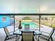 Covered patio overlooking a refreshing pool, perfect for entertaining at 8613 Beth Ct, Odessa, FL 33556