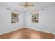 Bright bedroom with hardwood floors and two windows at 4317 S Trask St, Tampa, FL 33611