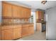 Charming kitchen with wooden cabinetry, granite countertops, and tiled backsplash at 4317 S Trask St, Tampa, FL 33611