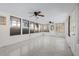 Spacious sunroom with multiple windows and dual ceiling fans providing ample natural light at 4317 S Trask St, Tampa, FL 33611