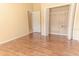 Bedroom with wood flooring, closet, and neutral paint at 2638 E Knights Griffin Rd Rd, Plant City, FL 33565