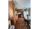 Kitchen featuring wooden cabinetry, a stainless steel oven and adjacent dining space at 2638 E Knights Griffin Rd Rd, Plant City, FL 33565
