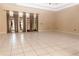 Spacious living room with tile floors, neutral paint, and large windows providing ample natural light at 2638 E Knights Griffin Rd Rd, Plant City, FL 33565