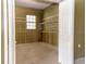 Ample storage space featuring shelving and a window for natural light at 2638 E Knights Griffin Rd Rd, Plant City, FL 33565