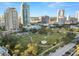 City park with green space and surrounding buildings at 405 Central Ave # 210, St Petersburg, FL 33701