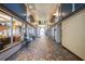 Building arcade with tile floors and shops at 405 Central Ave # 210, St Petersburg, FL 33701