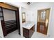Bathroom with marble vanity and built-in shelves at 405 Central Ave # 210, St Petersburg, FL 33701