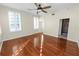 Spacious bedroom with hardwood floors and access to bathroom at 405 Central Ave # 210, St Petersburg, FL 33701