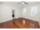 Bright bedroom with hardwood floors and ceiling fan at 405 Central Ave # 210, St Petersburg, FL 33701