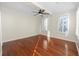 Bright bedroom with hardwood floors and ceiling fan at 405 Central Ave # 210, St Petersburg, FL 33701