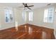 Well-lit bedroom with hardwood floors and plantation shutters at 405 Central Ave # 210, St Petersburg, FL 33701