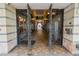 Entrance to a building with ornate metal gates and tile flooring at 405 Central Ave # 210, St Petersburg, FL 33701