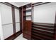 Large walk-in closet with custom shelving and rods at 405 Central Ave # 210, St Petersburg, FL 33701