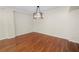 Bright dining area with hardwood floors and chandelier at 405 Central Ave # 210, St Petersburg, FL 33701