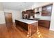 Modern kitchen with dark wood cabinets, marble countertops, and stainless steel appliances at 405 Central Ave # 210, St Petersburg, FL 33701