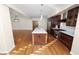 Spacious kitchen featuring dark wood cabinets and granite countertops at 405 Central Ave # 210, St Petersburg, FL 33701