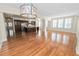 Sunlit living room featuring hardwood floors and large windows at 405 Central Ave # 210, St Petersburg, FL 33701