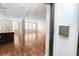 Open living room with hardwood floors and a view of the kitchen at 405 Central Ave # 210, St Petersburg, FL 33701