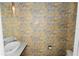Stylish powder room with a chic floral wallpaper and vessel sink at 405 Central Ave # 210, St Petersburg, FL 33701