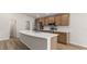 Modern kitchen with a large island, stainless appliances, and lots of cabinet space at 6929 161St E Ter, Parrish, FL 34219