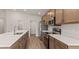 Well-equipped kitchen boasting stainless steel appliances, light countertops, and cabinet storage at 6929 161St E Ter, Parrish, FL 34219