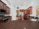 Modern kitchen with dark wood cabinets and granite countertops at 205 Bon Vie Pl, Valrico, FL 33594