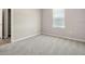 This bedroom features soft carpeting, neutral walls, and a closet for storage solutions at 2634 58Th E Cir, Palmetto, FL 34221