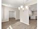 Dining area with chandelier lighting and access to the kitchen and living room at 2634 58Th E Cir, Palmetto, FL 34221