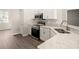 Modern kitchen featuring stainless steel appliances, stone countertops and white cabinetry at 2634 58Th E Cir, Palmetto, FL 34221