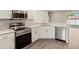 Modern kitchen with stainless steel appliances, granite countertops, and ample cabinet space at 2634 58Th E Cir, Palmetto, FL 34221