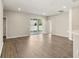 Spacious living room featuring wood floors and sliding glass doors to the backyard at 2634 58Th E Cir, Palmetto, FL 34221